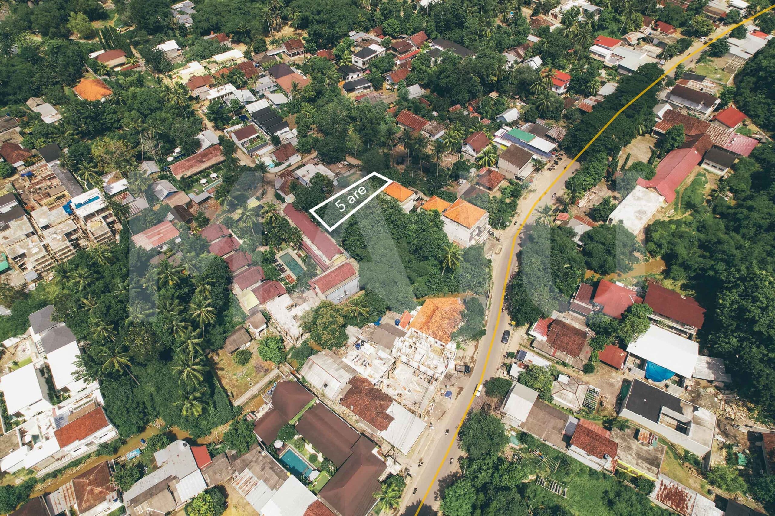 Aerial view of a 5 are plot for sale in central Kuta Lombok