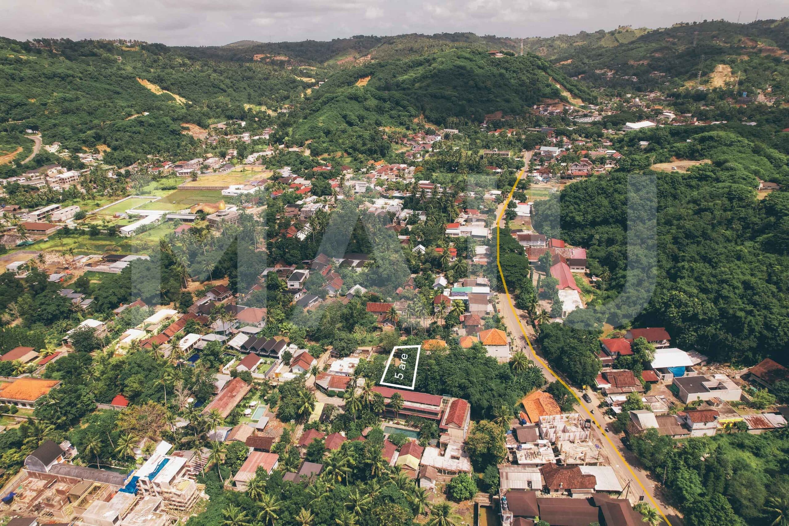 Aerial view of a 5 are plot for sale in central Kuta Lombok